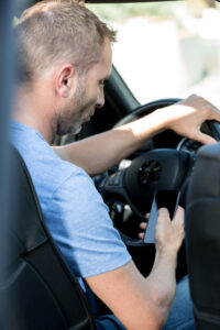 driver on the phone while driving a car